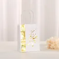 Detail of white gift bag featuring elegant gold foil Arabic script and woven handles - 21x15x8cm / White Style A