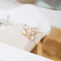 Gold-plated hand-shaped stud earrings featuring a round sparkling cubic zirconia gemstone - Hand Palm Diamond / Gold