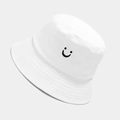 Close-up of white cotton bucket hat with black embroidered smile face and reinforced stitching - M (56-58cm) / White