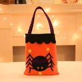 Orange Halloween non-woven gift bag featuring a black spider and purple striped handle - Spider Style