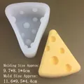 Detailed view of cheese-shaped silicone mold with its finished wax candle product - Large Triangle Cheese Mold - Translucent