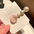 Detailed view of pink resin shell hair clip with three gradient faux pearls on a card - 5* Beaded Large Shell - Pink