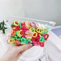 Close-up of assorted colorful small cotton elastic hair ties in a clear zipper bag - Fluorescent Color Daisy Bag