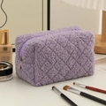 Close-up of a purple fleece pencil case with quilted texture on a white desktop - 18*10*10cm / Purple