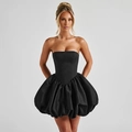 Detail view of black strapless mini dress featuring a voluminous puff skirt and satin finish - XS / Black