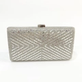 Close-up of elegant silver clutch purse featuring geometric X-pattern rhinestone crystal texture - Silver