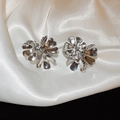 Macro shot of silver floral earrings with polished metal petals on white silk fabric - Style 22# S925 Silver Pin Silver Flower Petal Studs