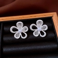 Macro view of silver flower stud earrings with mesh petals and center pearl detail - Silver Hollow Mesh Flower Style (25#)