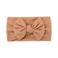 Soft nylon baby headband in camel brown featuring a large decorative bow accessory - Camel