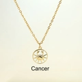 Golden Cancer zodiac necklace featuring white enamel circle and crystal crab pendant - Cancer