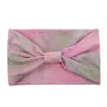 Detail of wide-brimmed tie-dye sports headband with a twisted knot design and pink-green texture - Tie-Dye Pink Green
