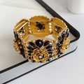 Detail of vintage flower bracelet with gold base and black white rhinestones - Gold Base Black Rose Style