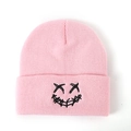 Pink knit beanie with black embroidered punk smiley face and trendy folded brim - One Size / Pink