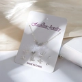 Parure de 9 bijoux argentés comprenant un collier cœur en strass et des boucles d'oreilles - Carte Blanche-Collier Cœur Strass Argenté et 4 Paires de Boucles d'Oreilles (Nœud/Cœur Gemme/Cœur Perle/Uni)