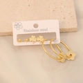 Gold stainless steel earring set featuring clover studs and flower hoop pendants - Clover Style