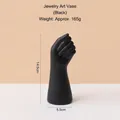 Minimalist matte black fist-shaped resin vase measuring 14.5cm height and 5.5cm width - Small Hand Vase - Black