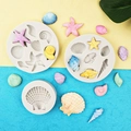 Macro detail of silicone mold shells and starfish shapes for ocean themed cake decoration - 3-Piece Set (Gray)