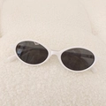 Kids vintage oval sunglasses with white frame and dark grey lenses on soft background - White