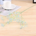 Detailed view of light blue gypsophila silk flowers on a minimalist wooden table - Diamond-Blue