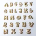 Macro display of full A-Z gold bubble letter pendants with sparkling crystal inlay - Letter A / Gold