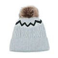 Close-up of cable knit winter hat with blue wave pattern and fluffy fur pompom - Gray