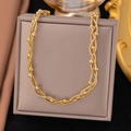 Braided gold stainless steel snake chain necklace with beads displayed on a jewelry box - Gold / Necklace