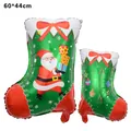 Detailed view of Christmas stocking foil balloons with Santa Claus and Merry Christmas print - Large Christmas Stocking / 60x44cm