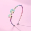 Glittery rainbow sequin headband for kids with a layered bow on a pink background - Rainbow Gradient Bow Headband