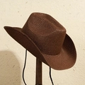 Handwoven dark brown straw cowboy hat with a black chin strap on a wooden display - M (56-58cm) / Dark Coffee (NZ0060)