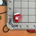 Mini red Christmas glove resin charm with white snowflake pattern and size measurement - Red Glove
