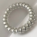 Silver-grey spiral phone cord hair tie with a frosted finish for seamless hold - Silver