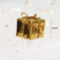 Golden Christmas cake topper featuring a gift box ornament on a white stick - Gold Foil Mini Gift Box Style