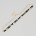 Bracelet perlé bohème chic avec perles noires et marbrées sur fond gris clair - Noir Or Gris-Bleu Marbre Tissé