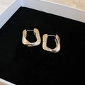 Silver twisted irregular metallic hoop earrings on black velvet padding for women - Irregular Ear Cuffs / Silver