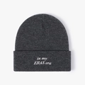 Dark grey knitted beanie with white 'in my ERAS era' embroidery on the cuffed brim - One Size / Dark Gray