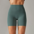 Close-up of high-waist seamless compression yoga shorts in deep teal with brushed fabric - Dark Green