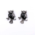 Vintage silver owl earrings with faceted black gemstone inlay on white background - Obsidian