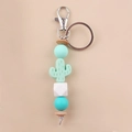 Detail of mint green silicone cactus keychain with wooden beads and silver metal ring - Mint Green