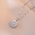 Silver rotating sunflower necklace with marquise zircon petals on beige fabric - Rotating Sunflower Necklace / Steel