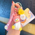 Detailed view of white cartoon duck keychain with pink rabbit hat and wrist strap - Pink Rabbit Headgear / Pink