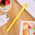 Cute yellow bear neutral pen featuring a creative 3D cartoon pendant on a wooden desk - Patch Bear Yellow