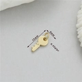Macro detail of 14K gold plated key pendant showing 15mm length and 0.42g weight spec - Key (h-12766)
