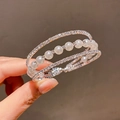 Close-up of triple-layered cuff bracelet featuring white pearls and sparkling zircons - 10# Bracelet - Silver - Triple Layer