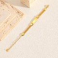 Pulsera de acero inoxidable dorada con placa personalizable y cadena de malla - Dorado