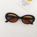 Retro oval kids sunglasses with black plastic frame and amber translucent lenses - Dark Brown