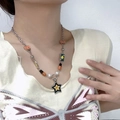 Y2K silver star necklace with orange heart, yellow smiley, and bead charms on a model - Smile Lucky Star Necklace P0001