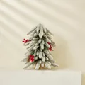 Mini artificial frosted Christmas tree with red berries and pine cones on wood base - Snow Flocked Tree With Decorations