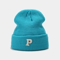 Close-up of sky blue knit beanie featuring a white plush P letter patch embroidery - Lake Blue