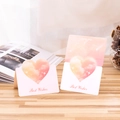Pink heart-shaped 3D greeting card with Best Wishes text on a wooden desk - Best Wishes / Light Orange