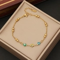Bracciale a perline dorate con ciondoli a cuore e occhio in smalto colorato - Multicolore